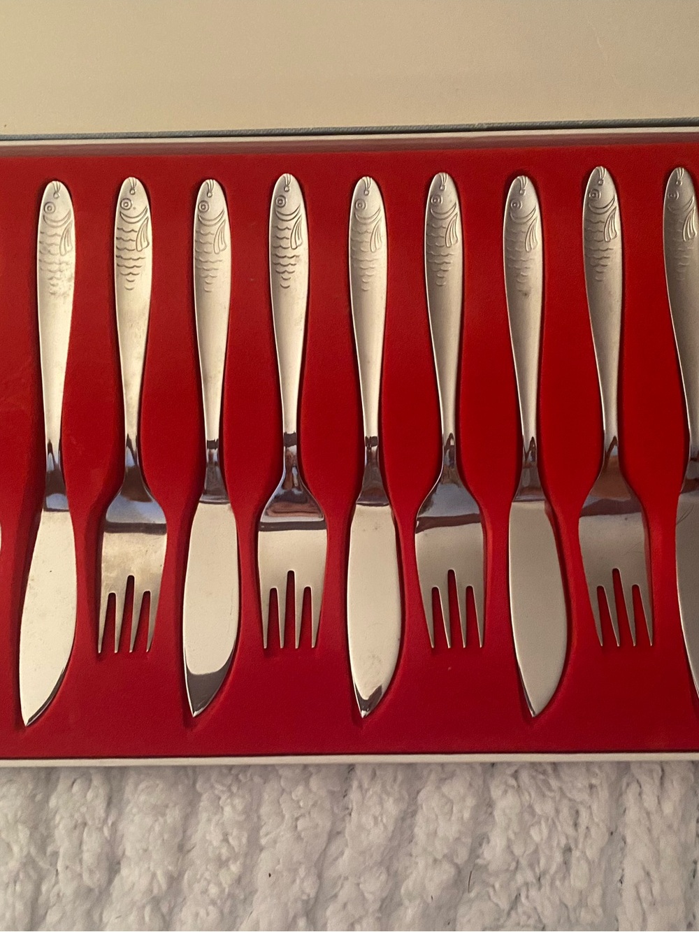 Silver Stainless Steel Fish-Engraved Flatware Knife Set on Blue Placemat - Picture 5 of 8